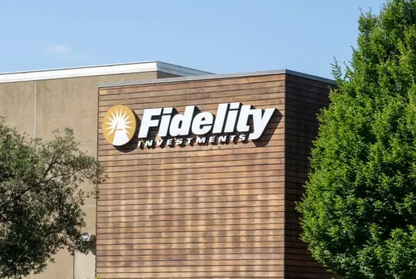 A Fidelity Investments sign on the side of a brown building.