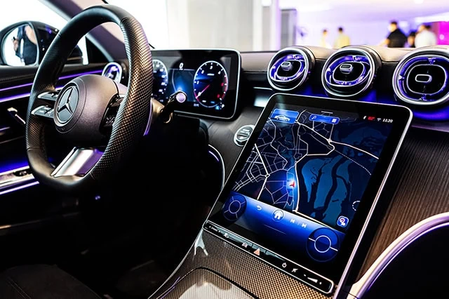 Young and the Invested's Favorite Tech Stocks for 2026 10 an infotainment system in a mercedes benz.