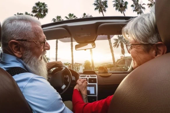 retirement senior car sunset road trip vacation