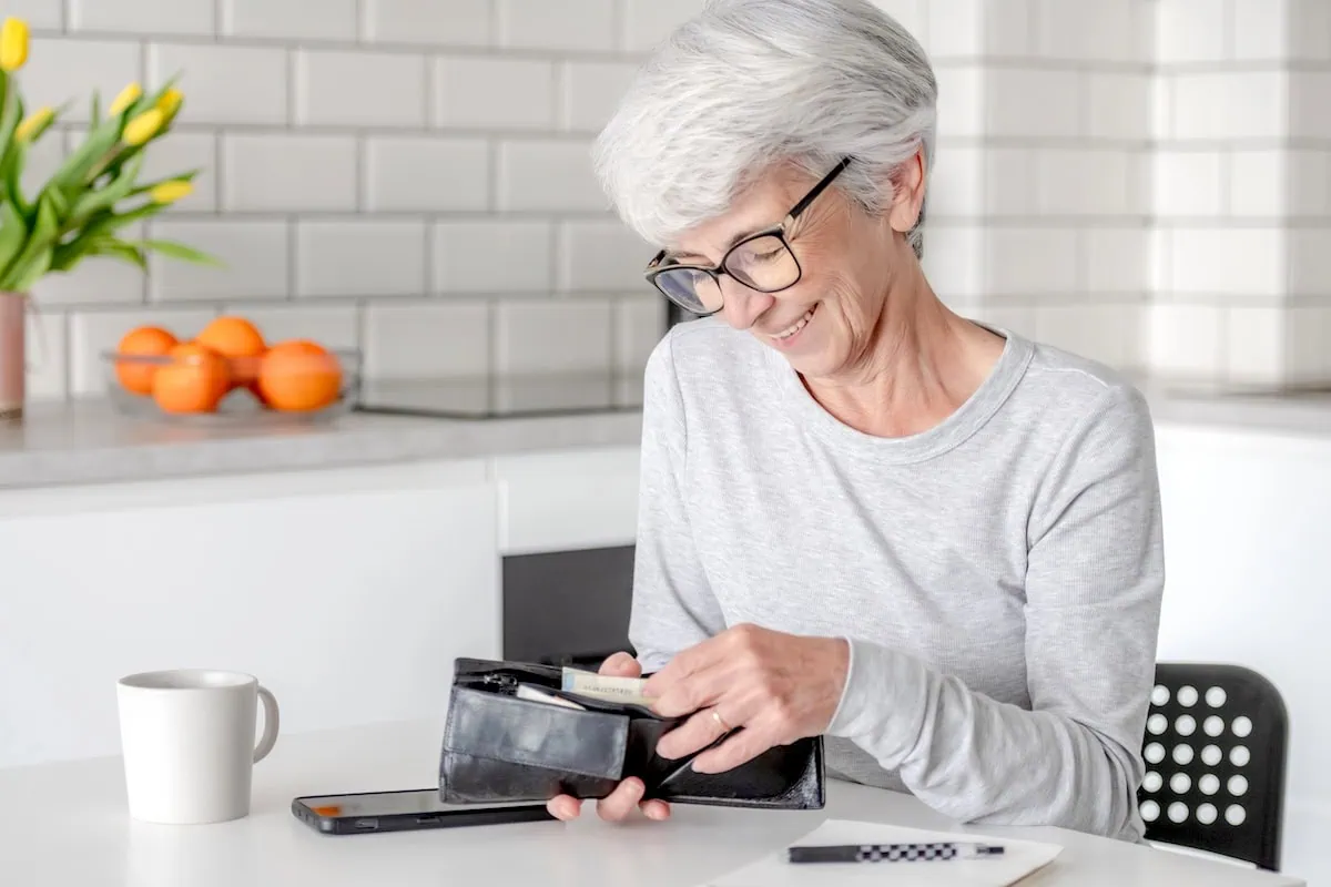 Financial Caregiving: How to Manage a Loved One's Finances 8 saving money budgeting senior wallet 1200