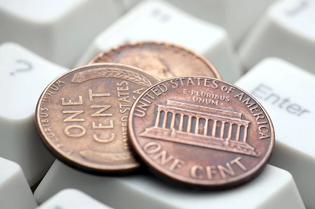 7 Best AI ETFs for the Artificial Intelligence Era 8 pennies on a keyboard.