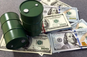 barrels of oil sitting atop stacks of cash.