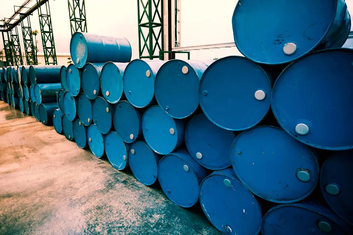 5 Best Energy ETFs for the Rise of Oil, Natural Gas + More 5 blue oil drums stacked on their sides.