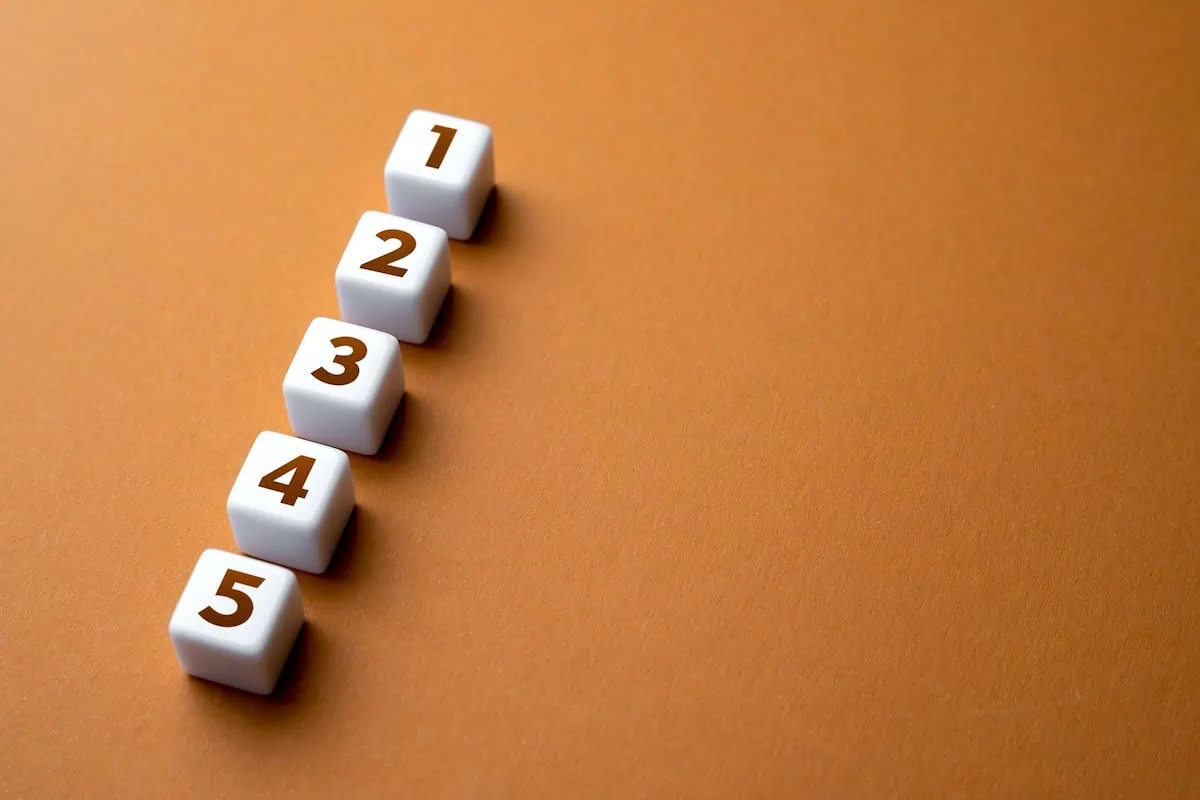 What Is FIRE? A Beginner's Guide to the Early Retirement Movement 3 Cubes showing the numbers one through five.