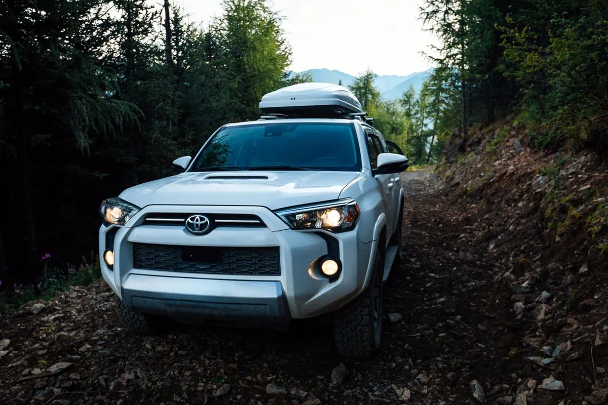 12 Easy Ways to Lower Your Gas Costs 6 a toyota SUV with roof cargo.
