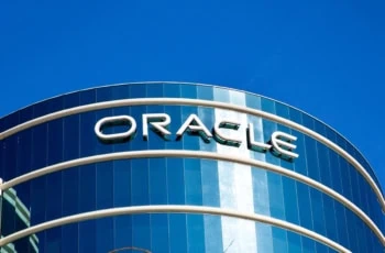 Oracle sign on a glass building.
