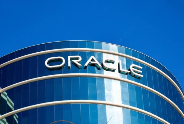 Oracle sign on a glass building.