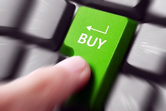 Cratering Chipotle (CMG) Stock Earns Upgrade From Argus 2 a person presses a keyboard button that says buy.