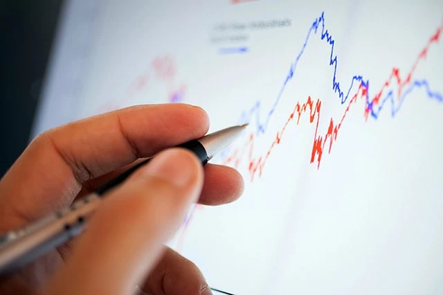 Argus Hikes Dell Technologies (DELL) Stock PT After Blowout Earnings 2 Close-up of a stock market graph on a computer screen.