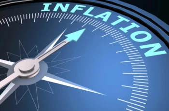 A compass that's pointing to the word inflation.