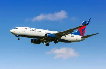 a delta air lines plane in the sky.