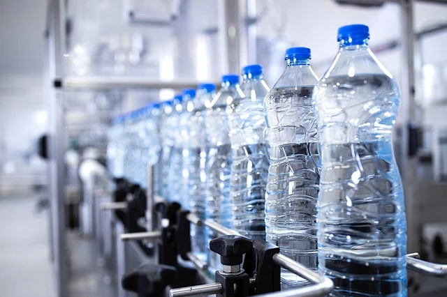The 10 Best-Rated Dividend Aristocrats Right Now 17 Bottles of water on a bottling assembly line.