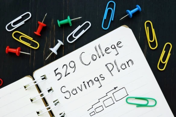 A notebook with 529 college savings plan written on it.