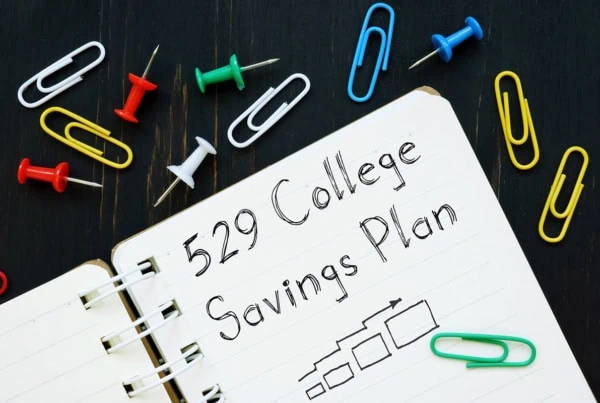 A notebook with 529 college savings plan written on it.