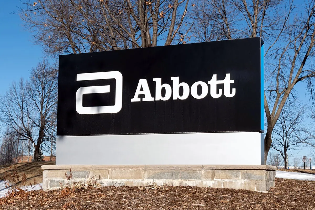 Wall Street Loves These 10 Dividend-Growth Stocks 5 an abbott laboratories sign with a black background.