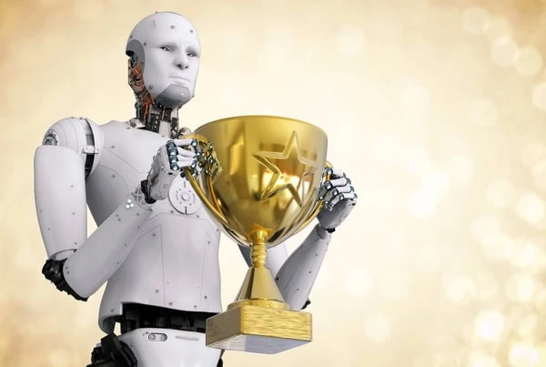 a humanoid robot holding a gold trophy.