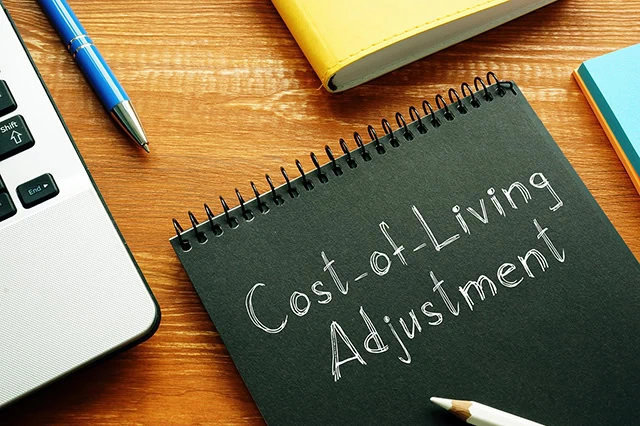a notepad that says cost of living adjustment.