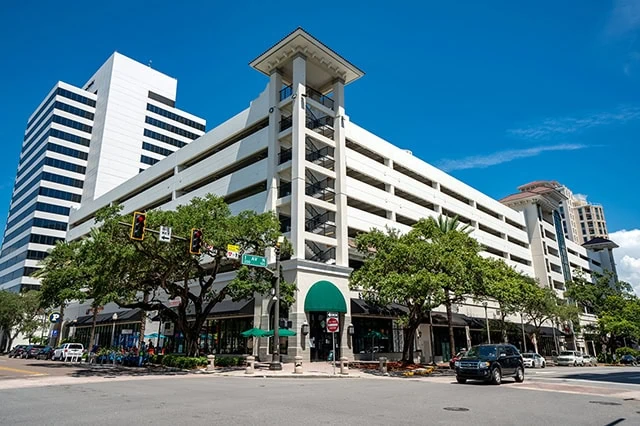 8 Best High-Yield Dividend Stocks: The Pros' Picks for 2026 5 a mixed-use commercial and residential building in florida.