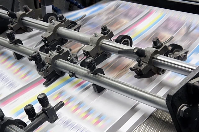 The 10 Best-Rated Dividend Aristocrats Right Now 14 pages speed through an industrial printer.