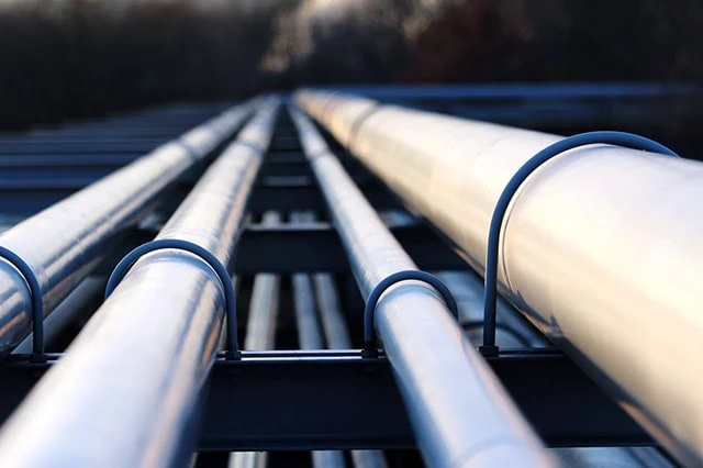 15 Best Long-Term Stocks to Buy and Hold Forever 21 oil pipelines stretch out into the horizon.