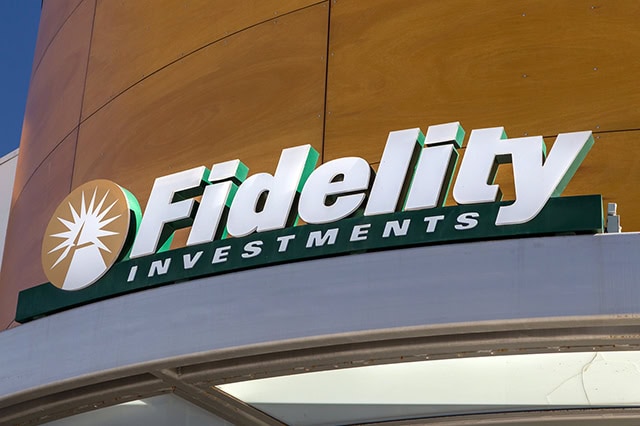 a green fidelity investments sign on the side of a building.