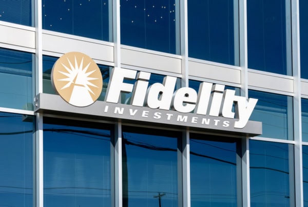 a fidelity investments sign on the side of a glass building.