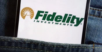 a smartphone in a persons rear jeans pocket has the fidelity logo on it.