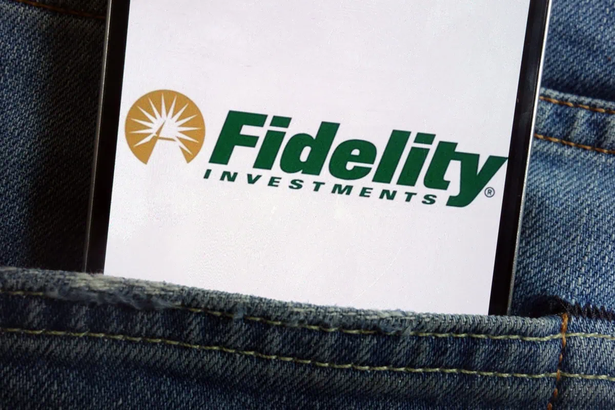 Beginner's Guide to Fidelity Target-Date Funds 4 a smartphone in a persons rear jeans pocket has the fidelity logo on it.
