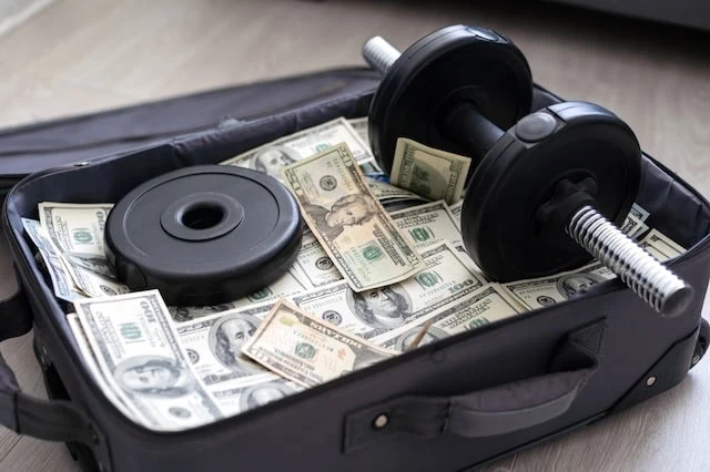 financial health suitcase cash dumbbell 640