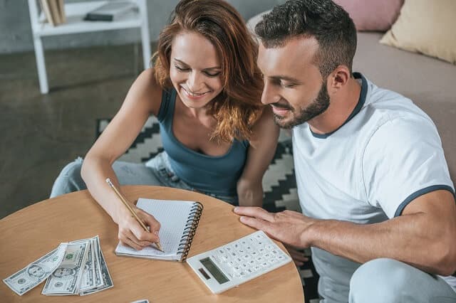 happy couple financial planning medium