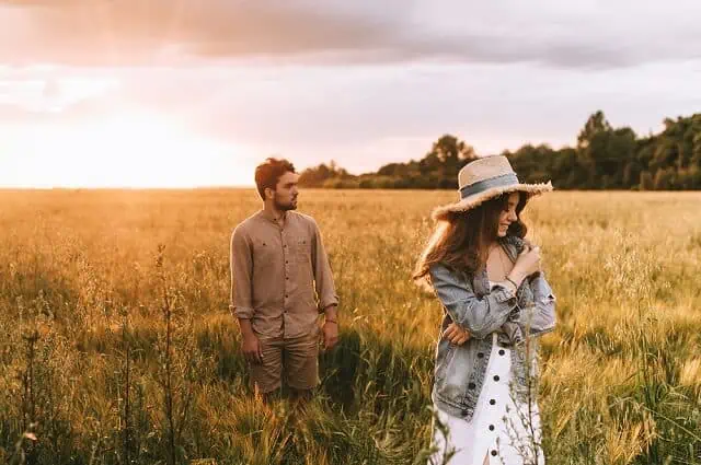 happy couple in field medium