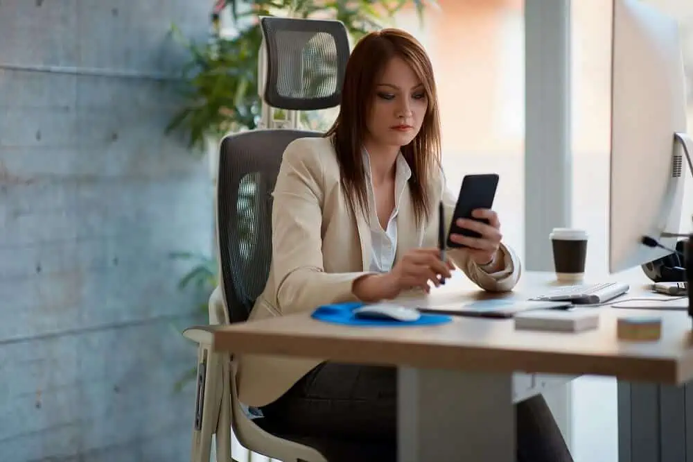 woman reviewing investments on her phone