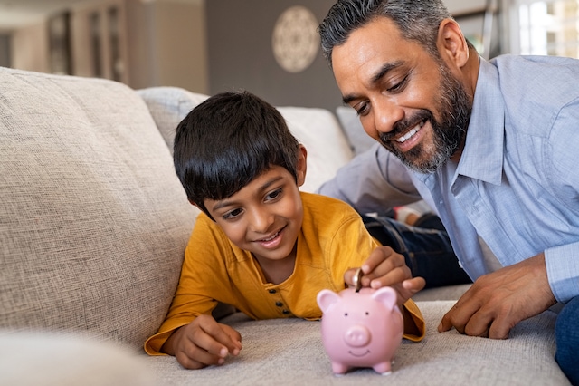 kid investment father son saving piggy bank