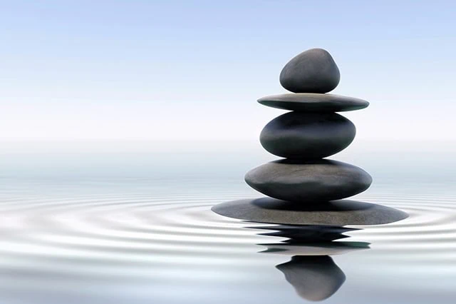 rocks balanced on water.