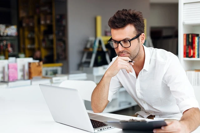 man computer laptop thinking