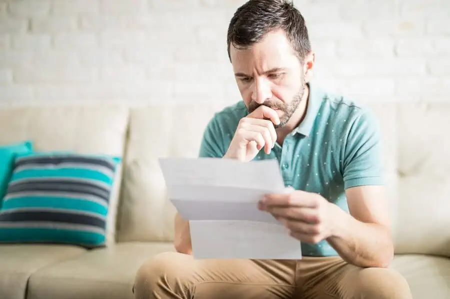 man looking at financial statement