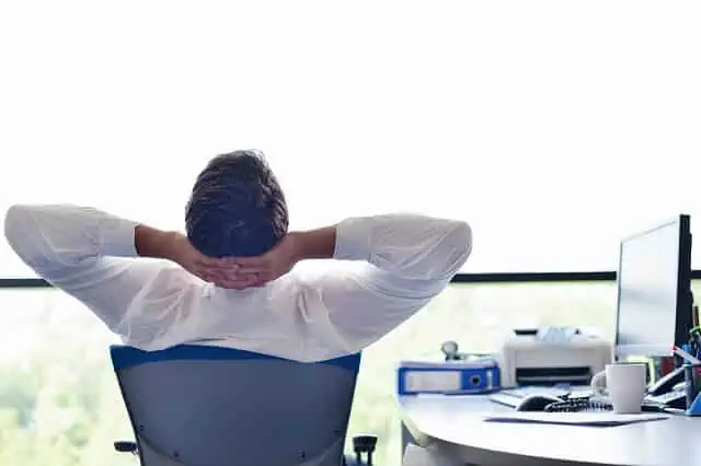 man relaxing looking out window medium