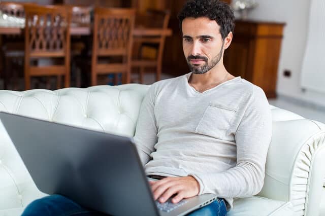 man reviewing information on computer