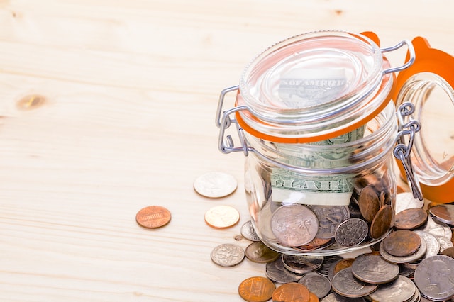 mason jar coins savings dollar bill