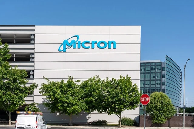 7 Best Growth Stocks to Buy for the Rest of 2026 10 micron sign on the side of a building.