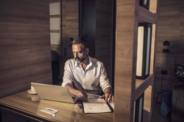 middle aged man working job late at night 640