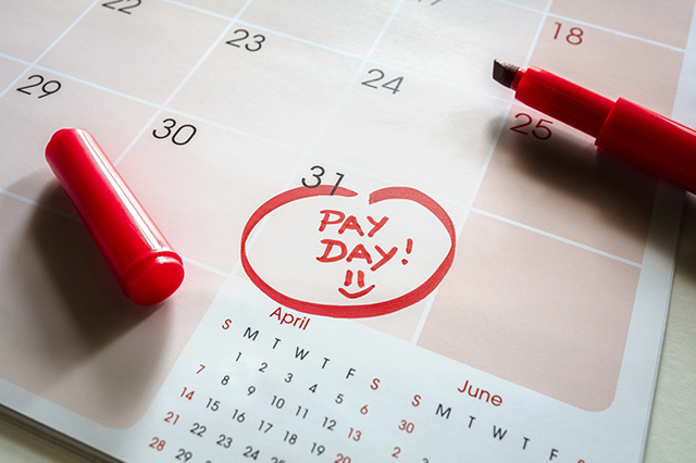 a calendar with the words "pay day" circled at the end of the month.