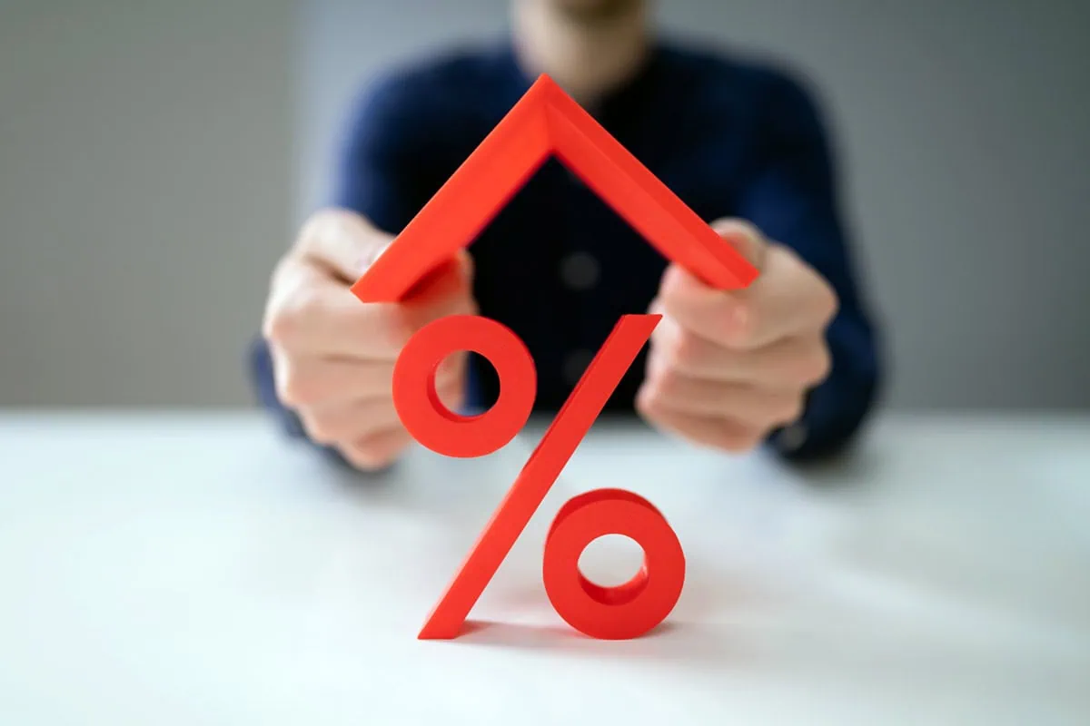 10 Best 'Rebound' Stocks to Buy for the Rest of 2026 3 concept art of a roof over a percent sign.