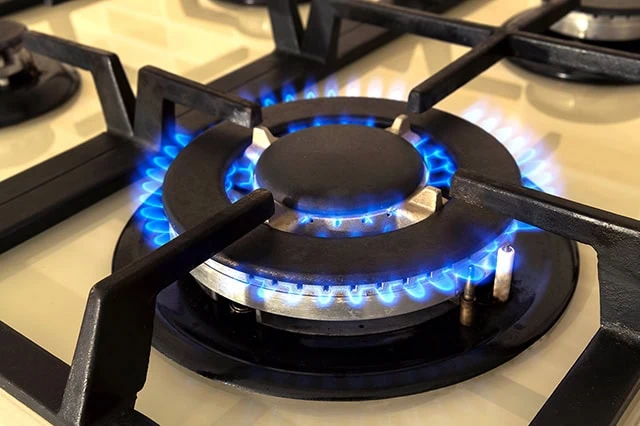 flames come out of a gas range.