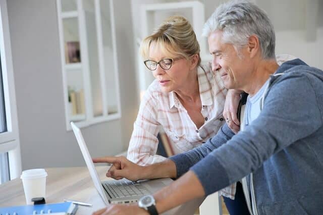 older couple reviewing financial information medium