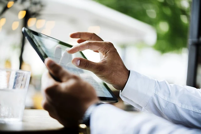 typing text on screen of digital tablet