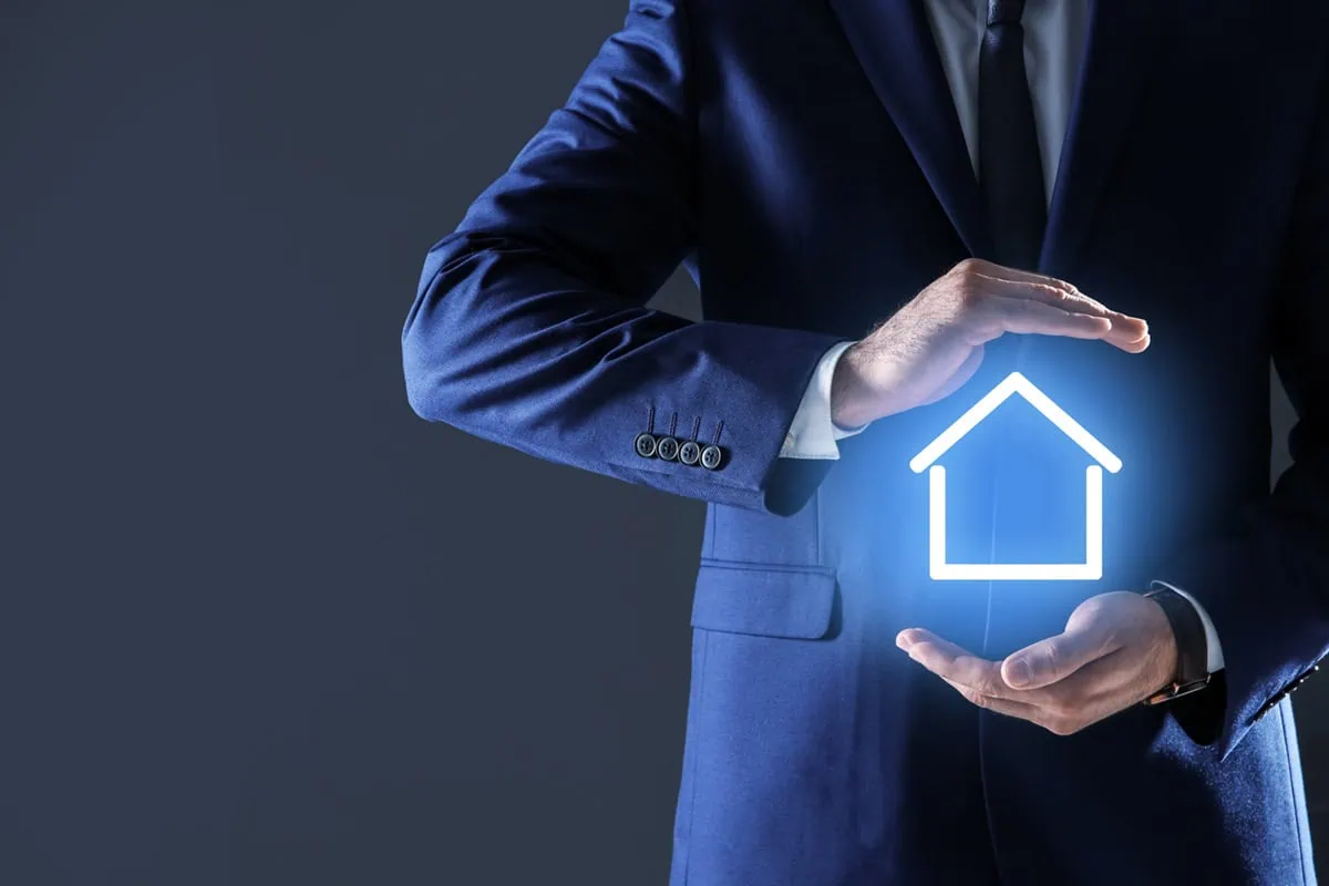 a businessman has his hands around a neon blue house signal.
