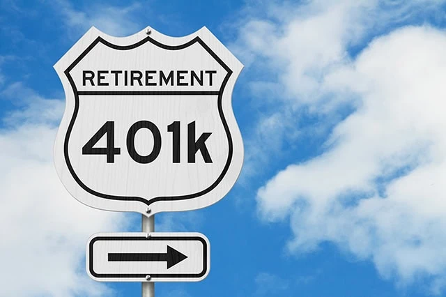 a white road sign that says retirement 401k.