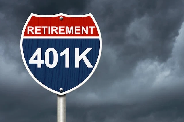 retirement road sign gloomy clouds 401k 640