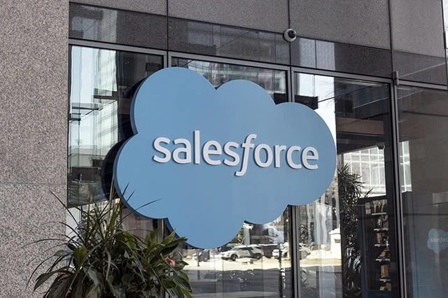 the salesforce logo on the glass front of a building.